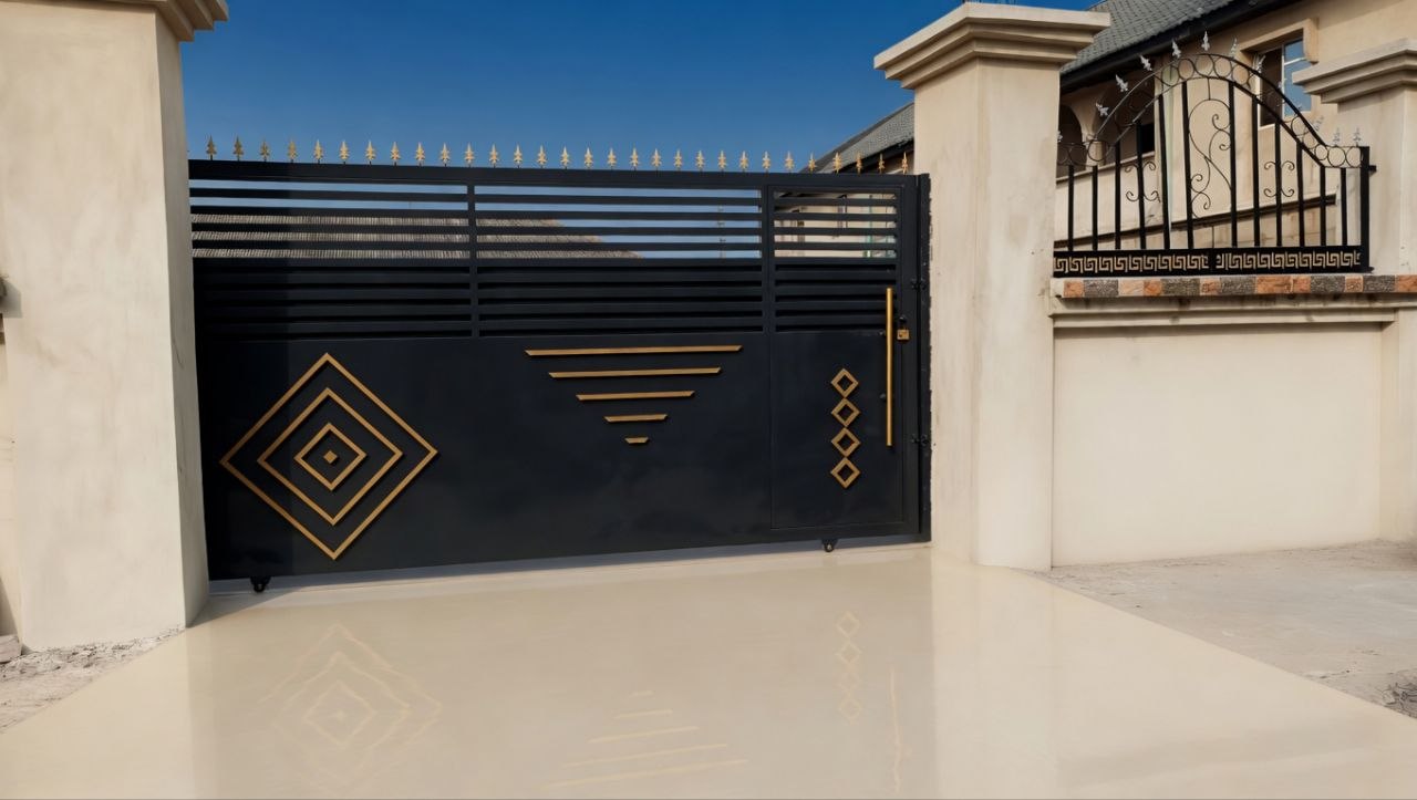 Custom black and gold sliding gate by Oluwaye Metal Works